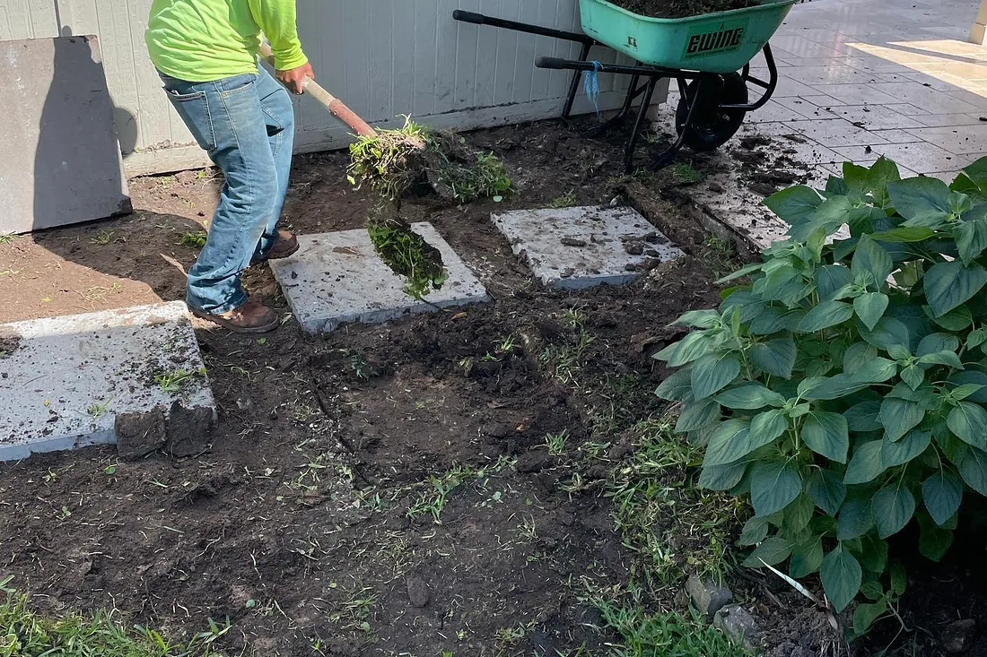 Isidoro Landscape & Irrigation crew installing a stone walkway on a Houston-area job