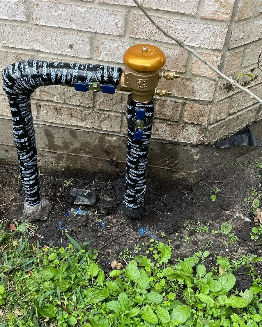 Brass backflow preventer installed on an irrigation system
