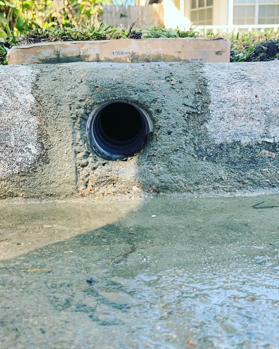 Drainage line run under a driveway