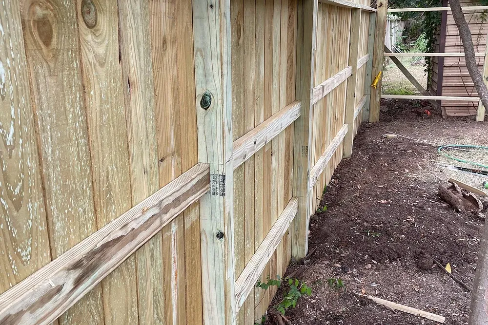 Newly installed cedar privacy fence